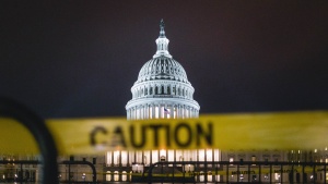 Photo of the U.S. Capitol in the background with caution tape in the foreground.