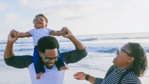 Father, mother and son at the beach.