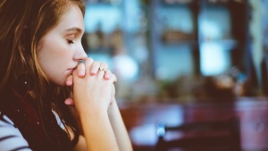 Photo of a woman praying.