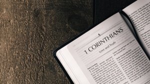 a Bible open to the book of 1 Corinthians