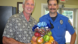 Richard Kennebeck shares a fruit basket with the local police department. 