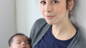 Caroline Roybal holding a baby from the Eagle’s Nest Orphanage. She was a participant in the project last year. 