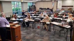 Photo of Scott Ashley addressing the ABC Class of 2021 in the lecture hall of the home office.