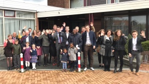 Photo of UCG-Netherland members in a group waving hello.