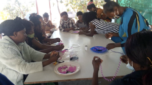 Women learned how to make bead jewelry and doormats at the women’s enrichment weekend in the Copperbelt. 