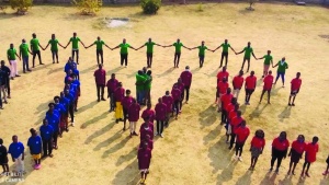 Aerial shot of campers and staff working together to form the UYC sign.