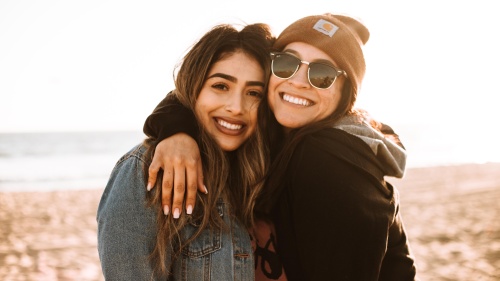 two young women standing outdoors