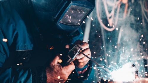 Man using welder.