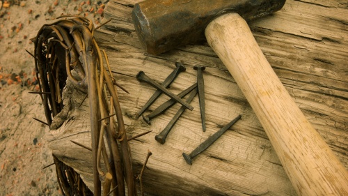 An reenactment of the items used in Jesus Christ cruxifixion - crown of thorns, nails, hammer and stake.