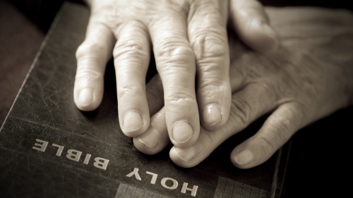 Hand on a Bible