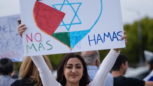 A woman holding up a No Hamas sign.