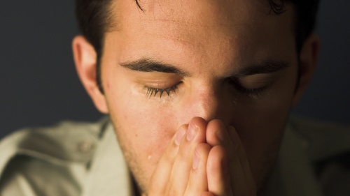 A man praying.