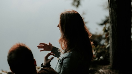 A woman talking to a friend.