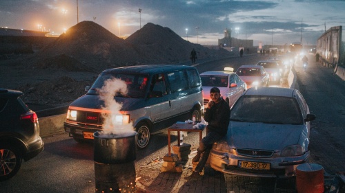 Cars going through a checkpoint from Ramallah, Palestine to enter Israel.