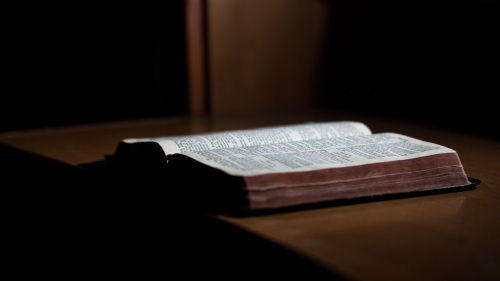 A Bible laying on a table.