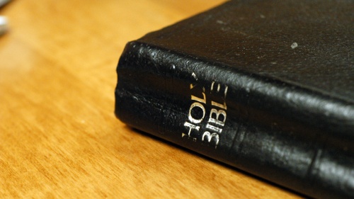 A Bible on a table.