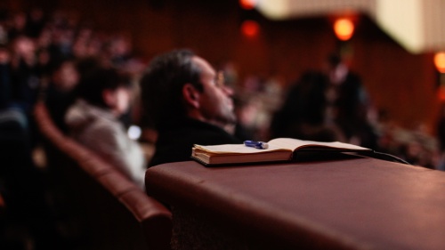 An audience listening.