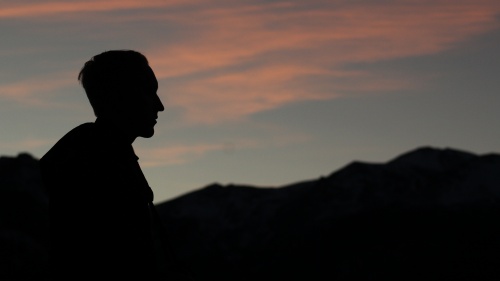 A silhouette of young man.