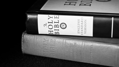 Two Bibles stacked on top of each other.