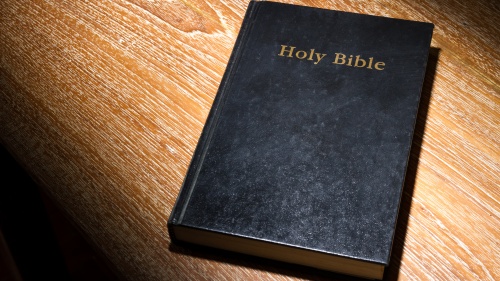 A Bible laying on a table.