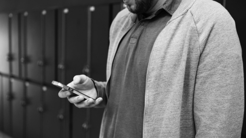 A man looking at his smartphone.