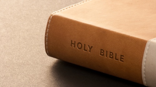 A Bible on a table.