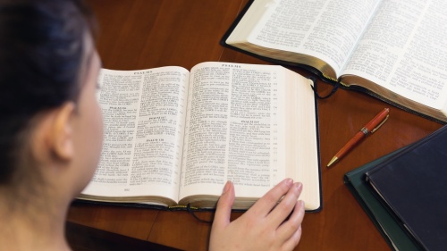 A woman reading the Bible.