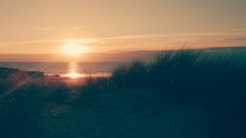 A sunset of a body of water.