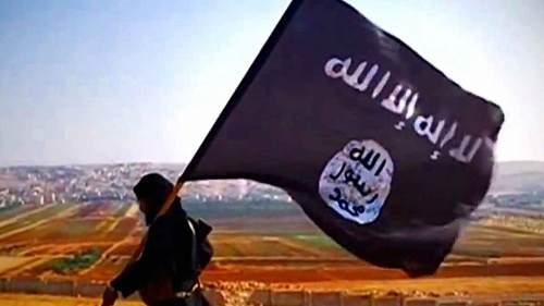 A man carrying a ISIS flag.