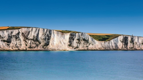 The White Cliffs of Dover are cliffs that form part of the English coastline facing the Strait of Dover and France. 