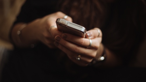 A woman using a smartphone.