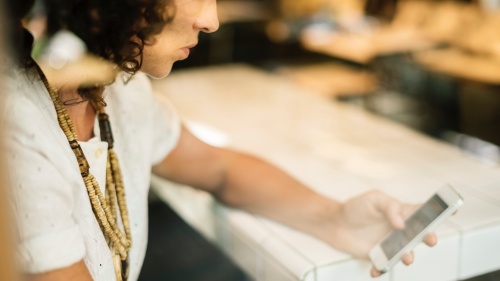 A woman looking at her smartphone.