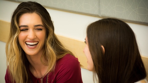 Two woman talking to each other.