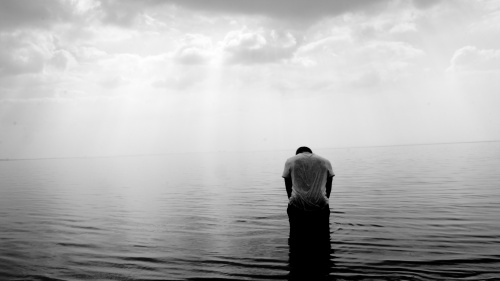 A man standing in water.