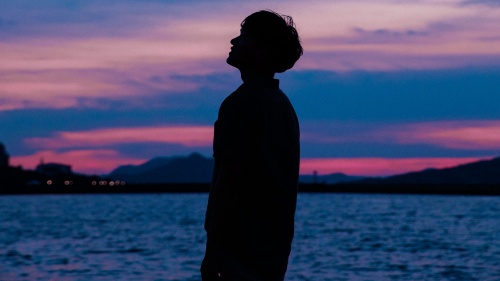 A silhouette of young man.