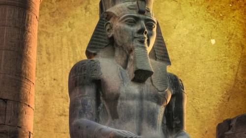 Colossus of Ramses II (made in black granite) in the Luxor Temple (Egypt)