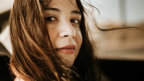 Up close photo of a woman's face.