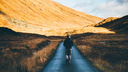 A man walking on a path.