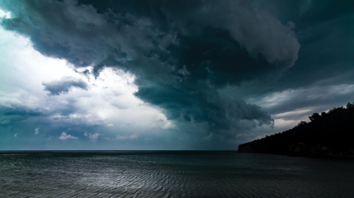 Photo of storm clouds over the ocean.