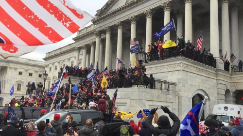 People gathering outside the Capitol building in Washington, DC.