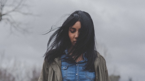 A woman walking alone.