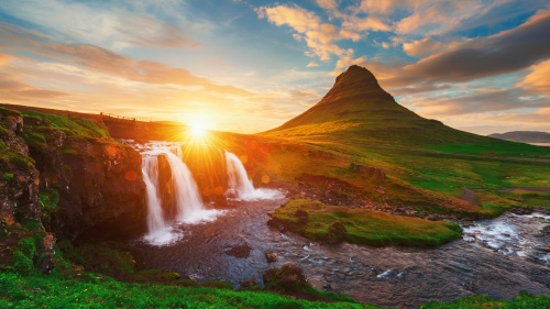 A gorgeous landscape photo of Kirkjufell in Iceland at sunset.