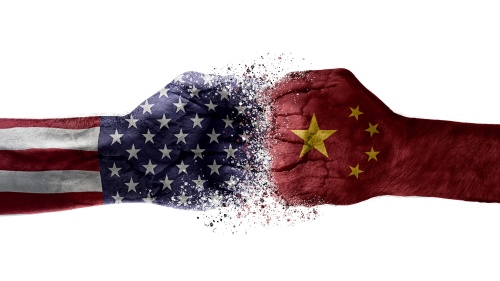 An artist illustration of two fists colliding with superimposed images of American and Chinese flags of fists.