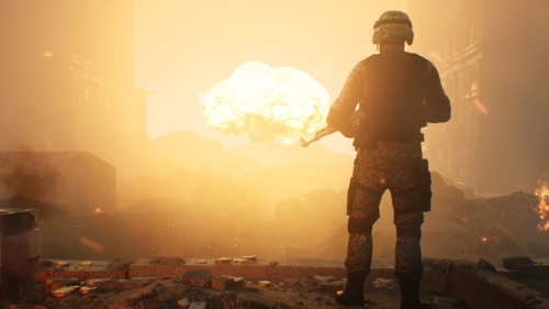 A soldier looking at a huge blast in the sky.
