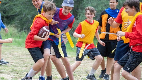 a group of boys playing with a football