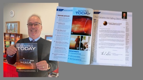 Gerald Bilyeu, holding a magazine and an open magazine spread beside him.