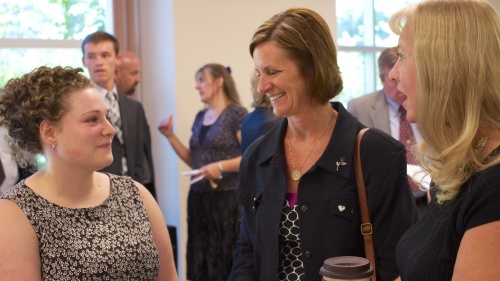 women talking at church services