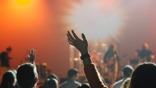 Church attendees worshipping during praise service.