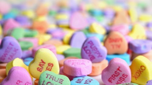 A pile of Valentine candy hearts.