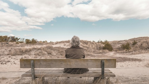 A person sitting on a bench.